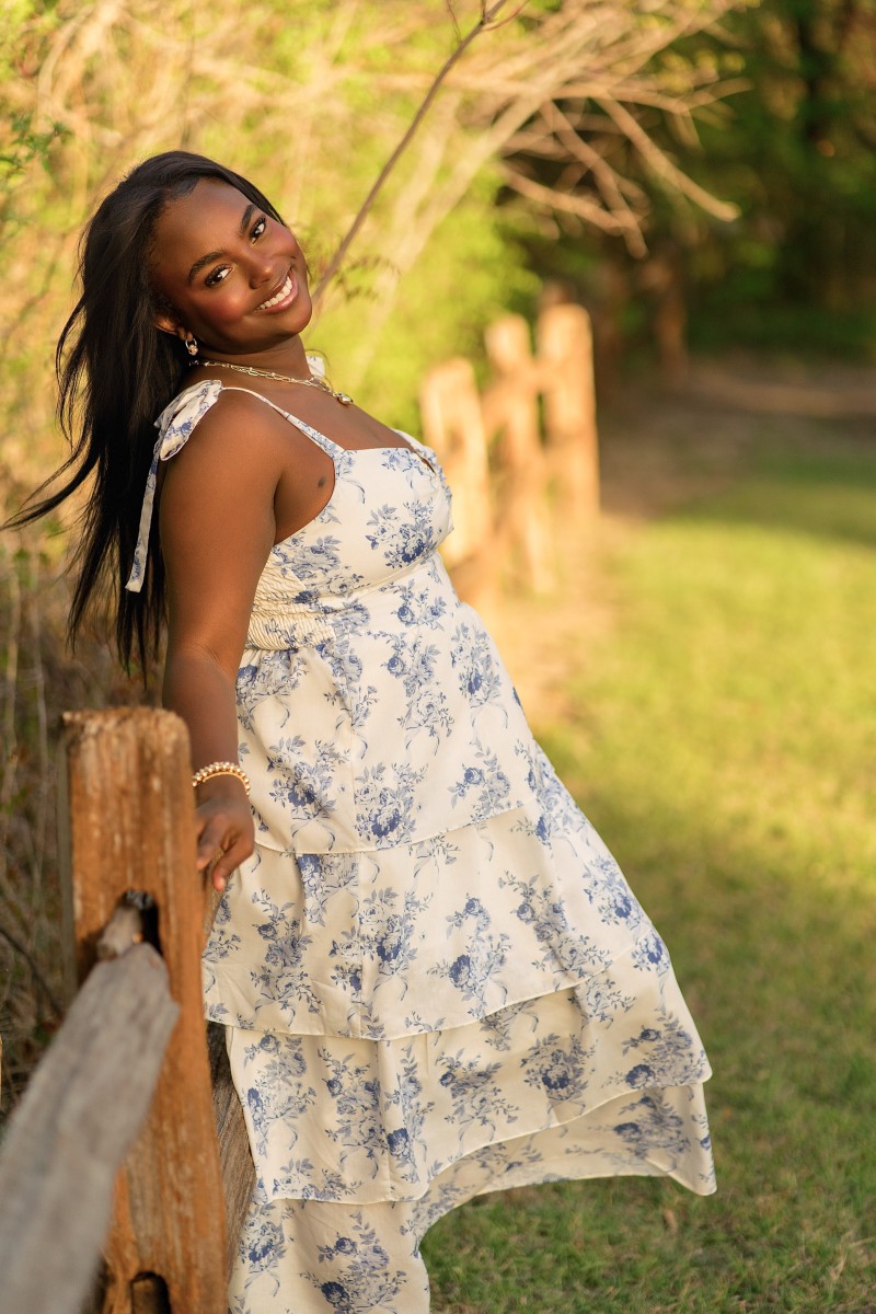 Senior portrait of Zoe at golden hour in Limestone Quarry Park, Frisco